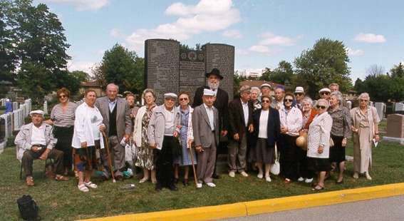 [group photo of survivors and their families]