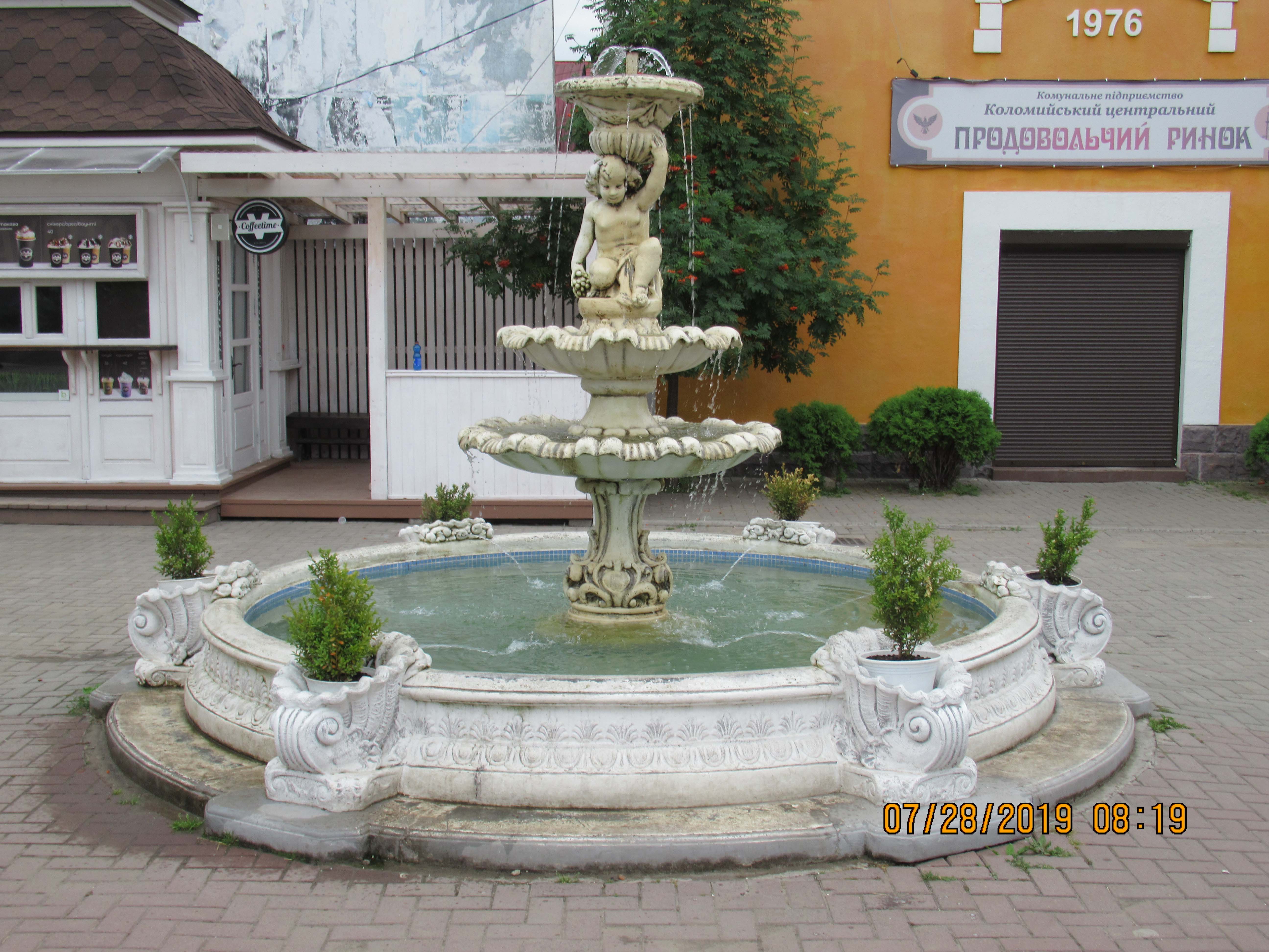 94. Water
                  fountain and statue in Renaissance Square Northern end
                  of Rynek