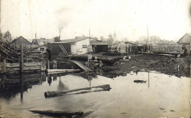View of
wood buildings and Orthodox church from
Narewka River