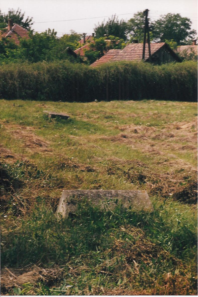 Housse bordering cemetery grounds