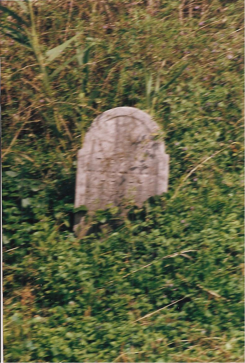 Tombstone sunk to the ground